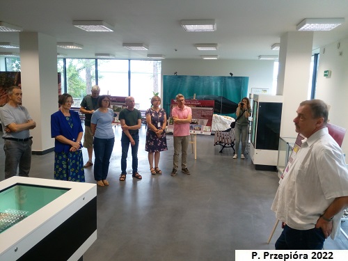 Lecturer explaining the board to the participants of the exhibition